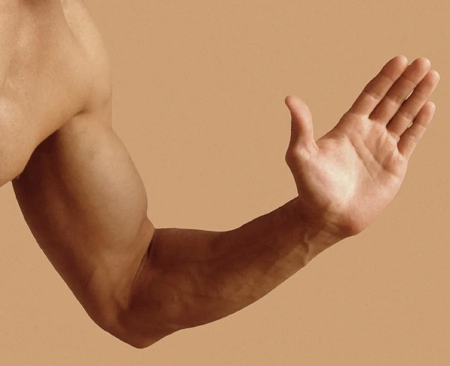 Outstretched arm with extended elbow and open hand